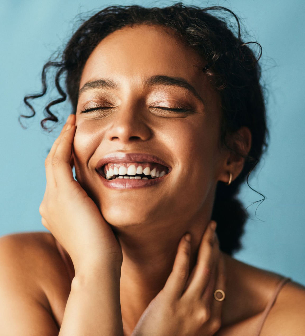 Cropped shot of a beautiful young woman posing against a grey background